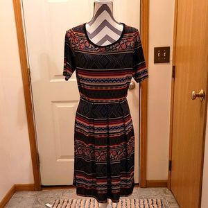 Flattering dress by Pretty Young Thing sz L/XL.